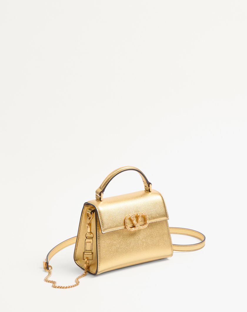 Valentino Handbags Borsa A Mano Mini Valentino Garavani Vsling In Vitello Granato Laminato Con Logo Gioiello per Donna in Violet | Valentino IT Vendita Calda